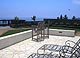 Another view from the deck shows sod area and planted areas skirting the yards edge.